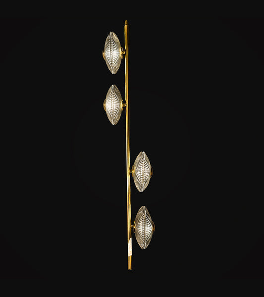 Teova Hanging light Discs of ribbed clear smoke glass capped in Aged Brass take cues from rippling waves